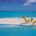 beach chairs water sand picture