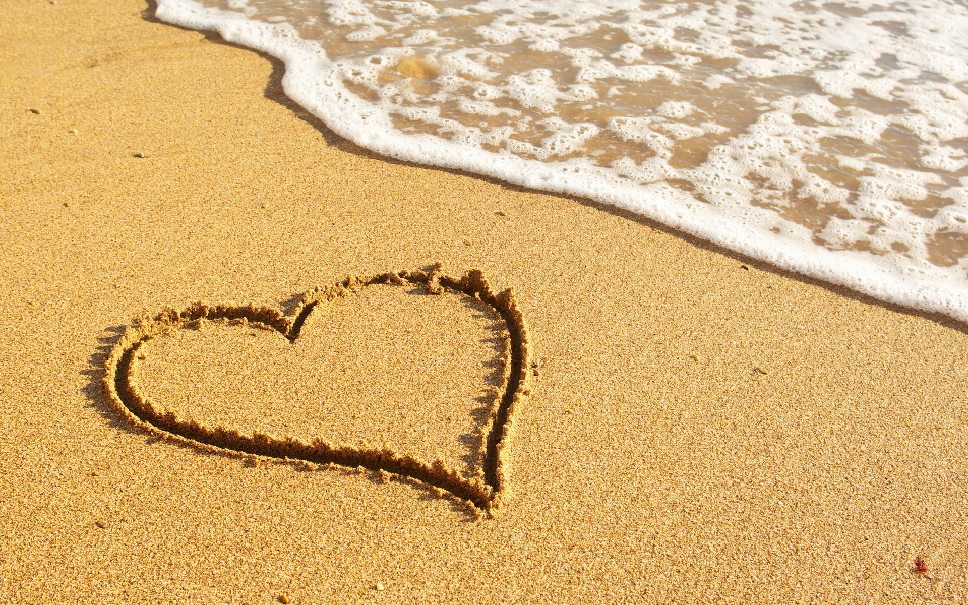 beautiful love heart on sand