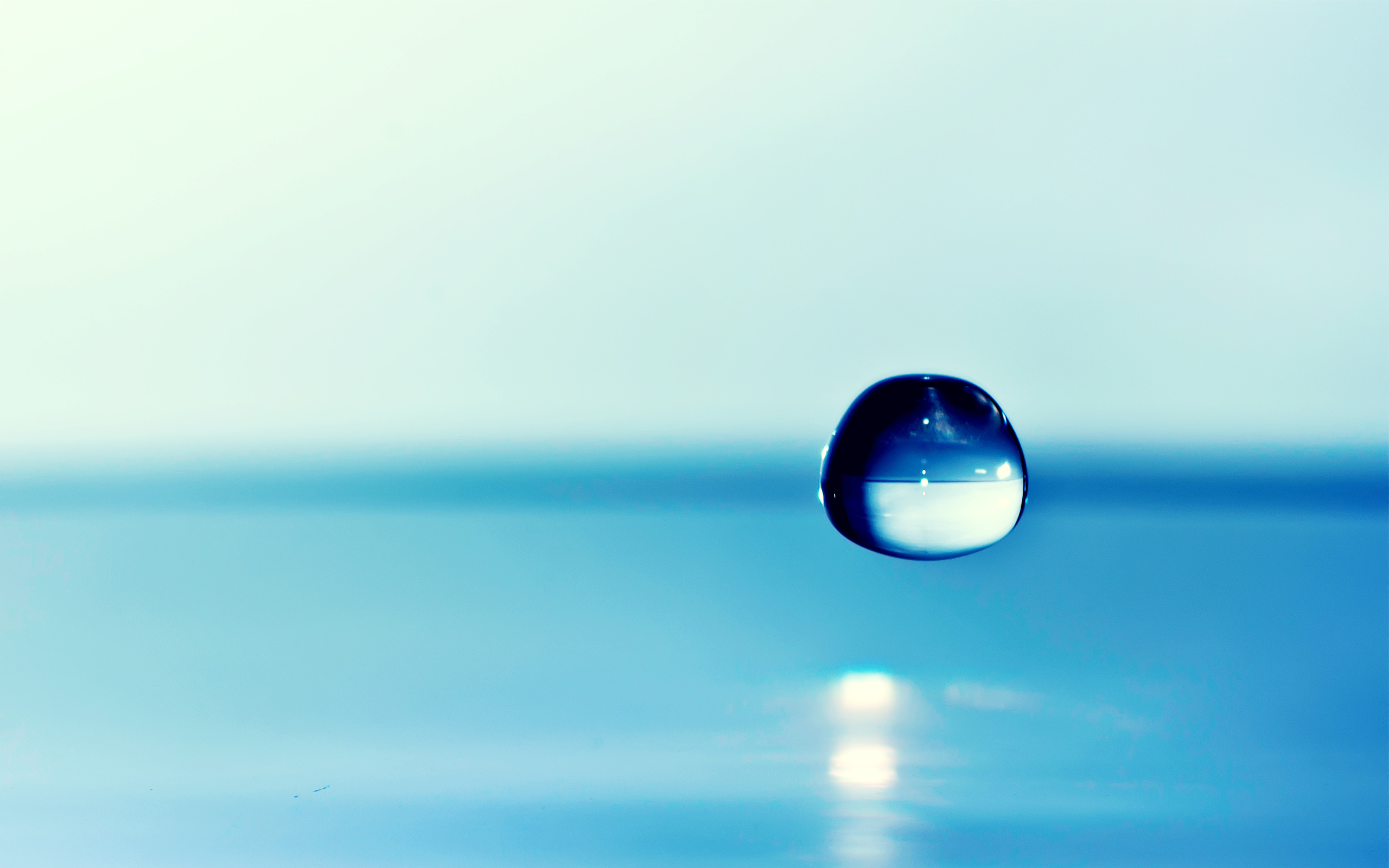falling blue drop of water