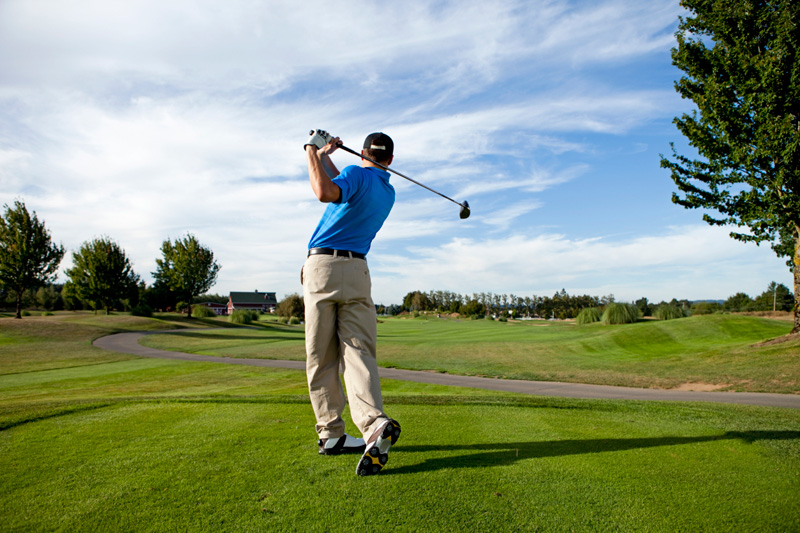 playing boy golf image