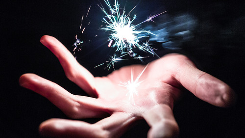 Sparkler in Hand Dark Wallpaper